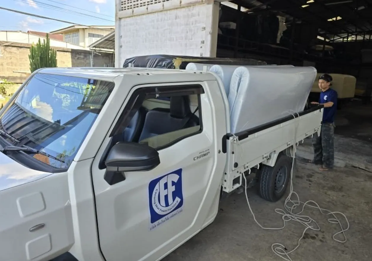 Chiang Mai Foam Factory delivery truck loading mattresses at the workshop
