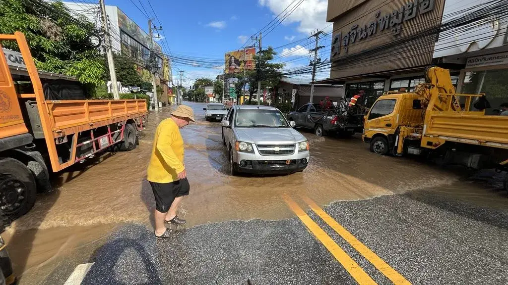 Standing in floodwater on a submerged road in Chang Klan, Chiang Mai, October 2024
