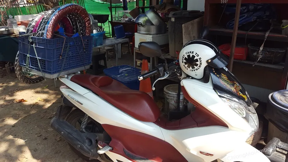 Motorbike loaded with spare tyres for roadside repair