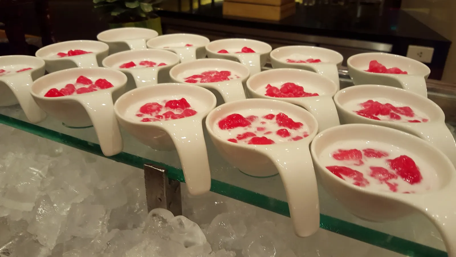 Panna cotta dessert cups chilled on ice