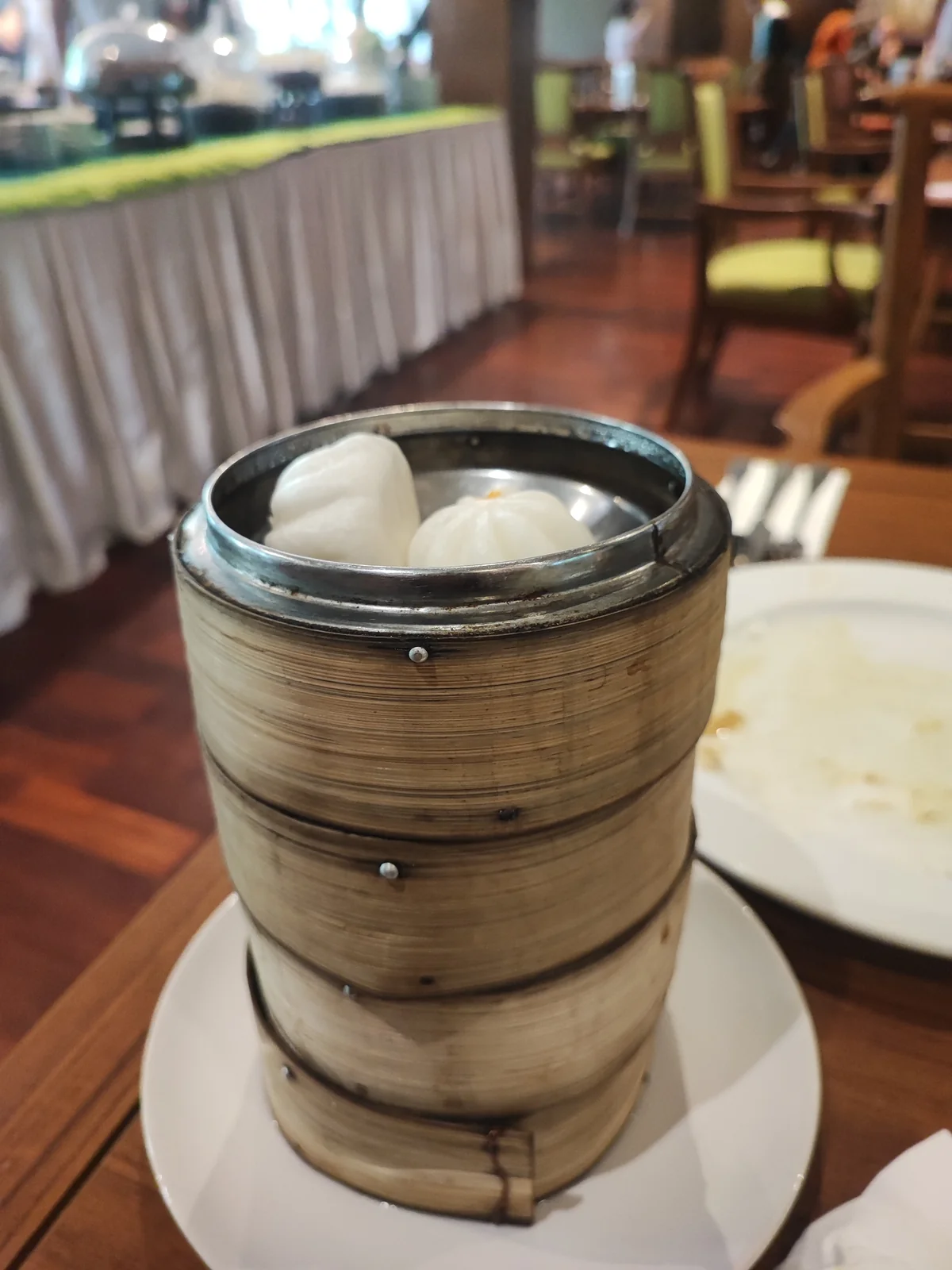 Dim sum buns in a bamboo steamer at Siripanna lunch