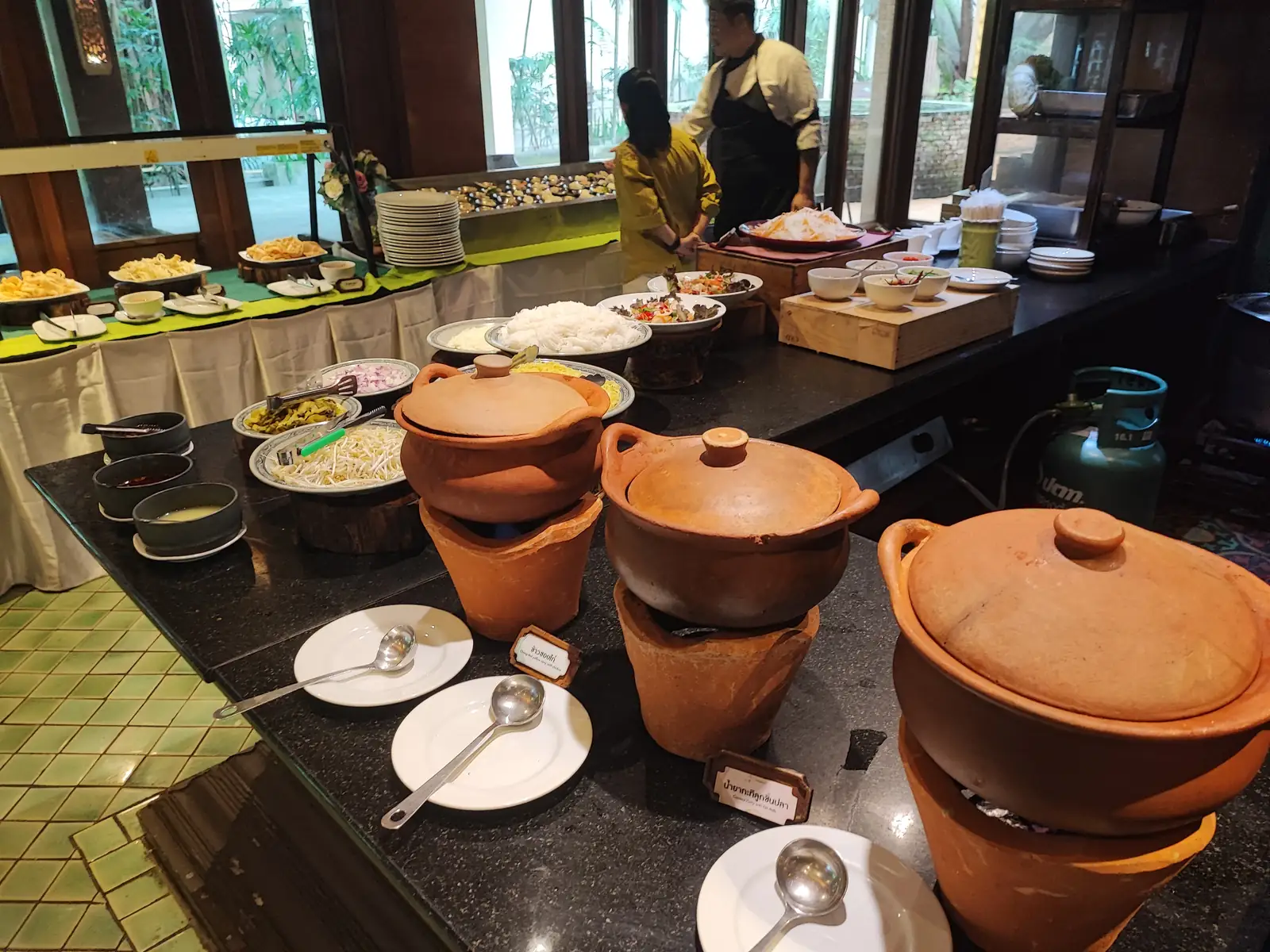 Chef preparing dishes at the Siripanna buffet cooking station