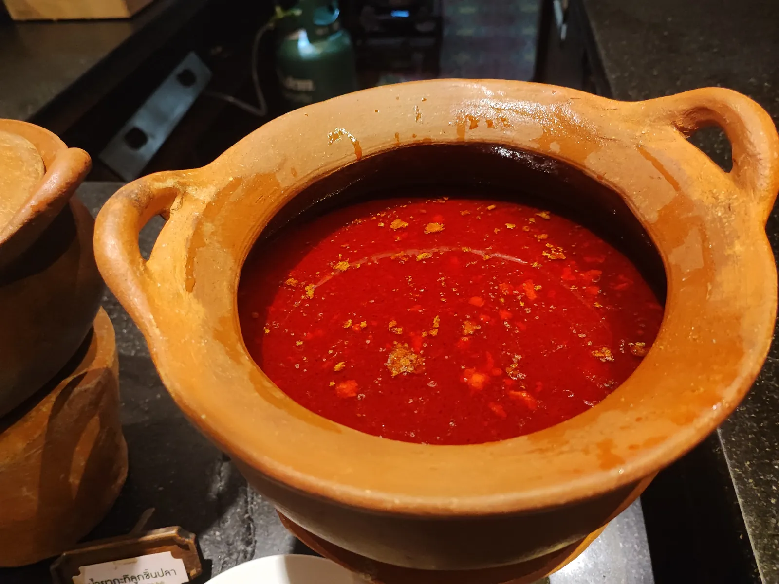 Nam prik chili sauce served in a clay pot