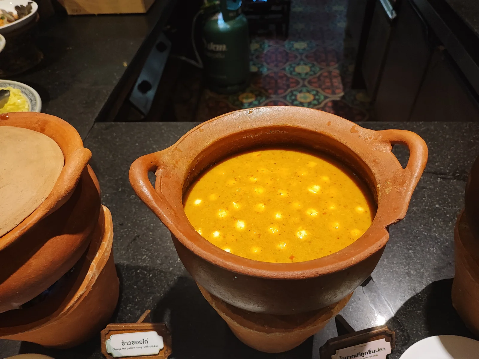 Chiang Mai yellow curry with chicken in a clay pot