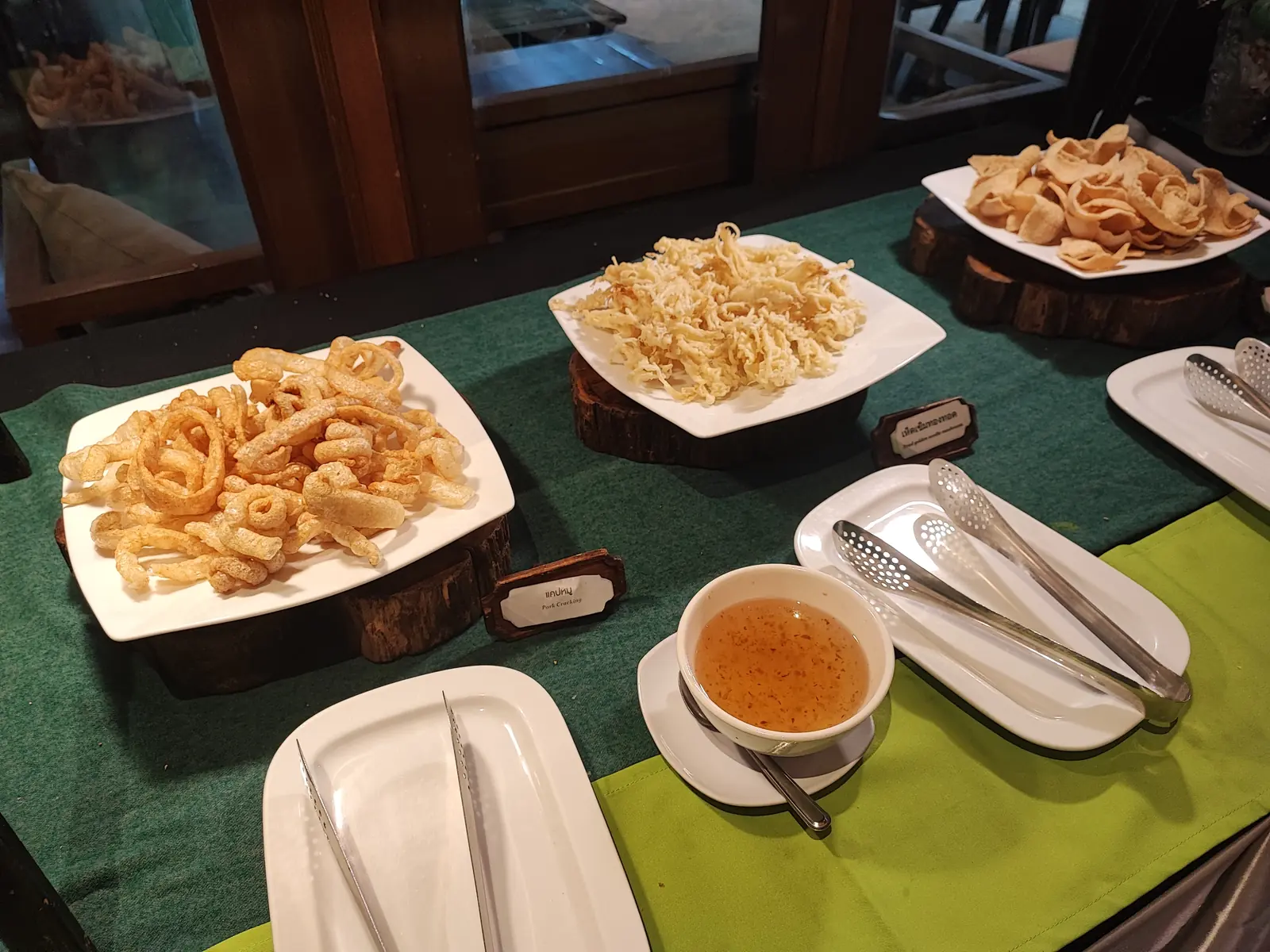 Pork crackling and crispy fried noodles on the snack table