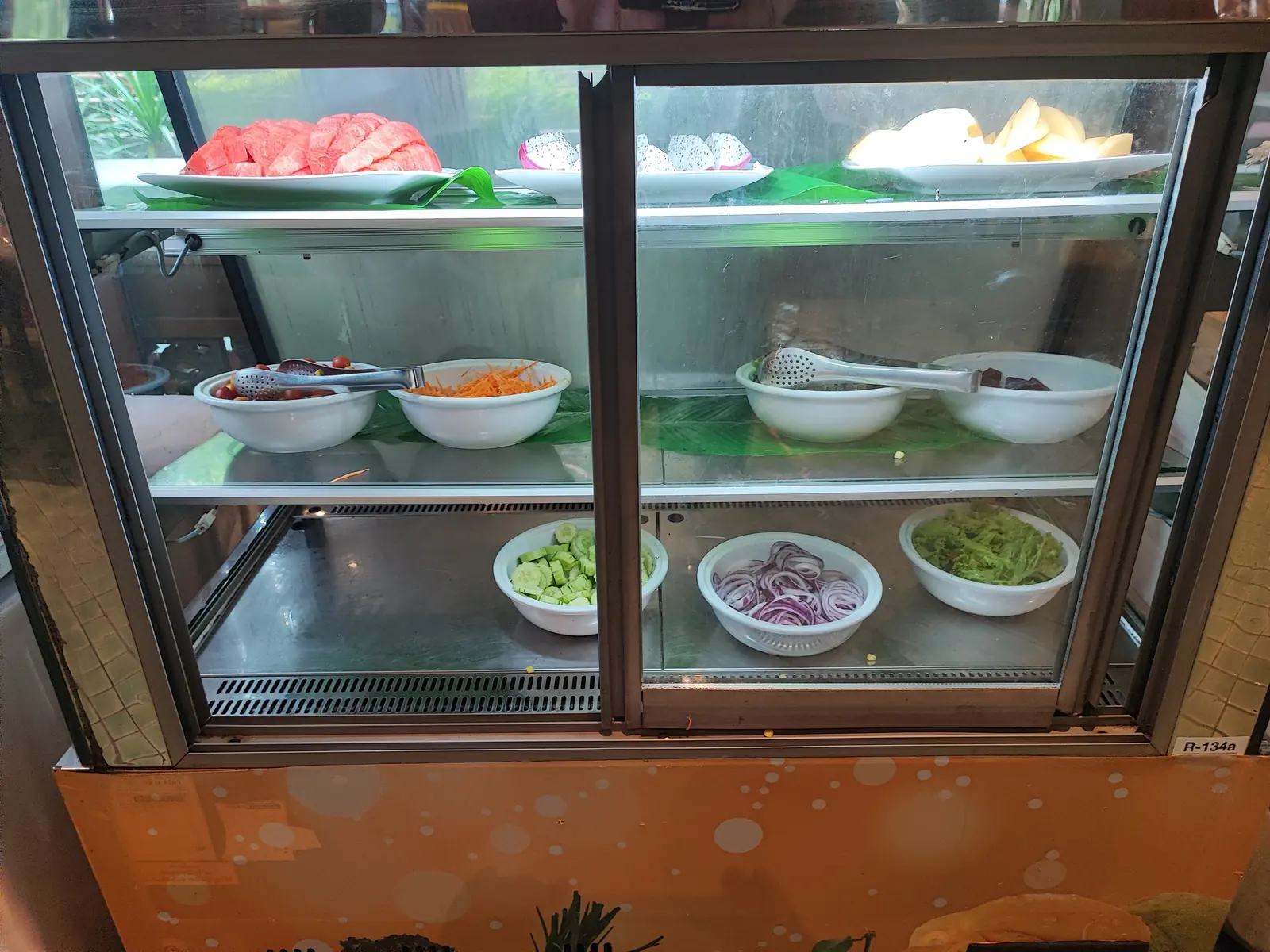 Fresh fruit display with watermelon, dragon fruit and melon