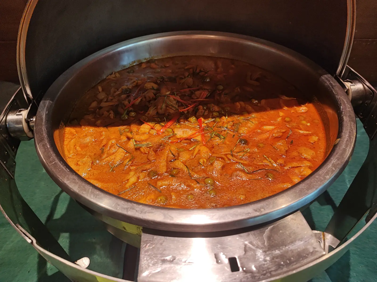 Two Thai curries side by side in the chafing dish