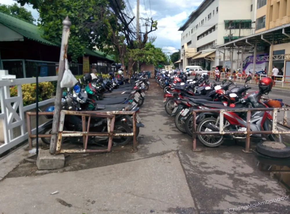 Motorbike parking rows along the hospital access road